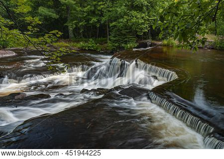 A Section Of The Upper Falls At Bond Falls State Scenic Area In Ontanagon County, Michigan Is Shaped