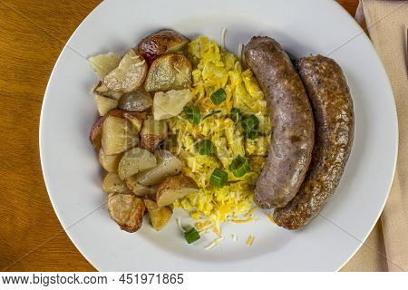 Scambled Eggs With Red Roasted Potatoes And Sweet Itian Sausages