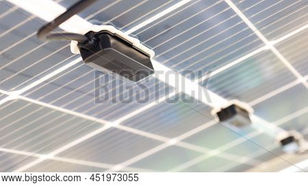 Solar Junction Box. A Row Of Black Diode Blocks Is Mounted Under The Solar Panels In A Smart Farm. C
