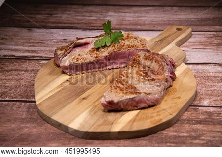 Recipe For Gratin Dauphinois, Grilled Veal Steak And Grilled Button Mushroom. High Quality Photo