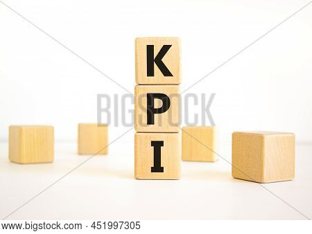 Kpi, Key Performance Indicator Symbol. Concept Word Kpi, Key Performance Indicator On Wooden Cubes O
