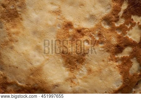Texture Of A Cooked Thin Pancake Closeup. Fried Pancakes. Pancake Week