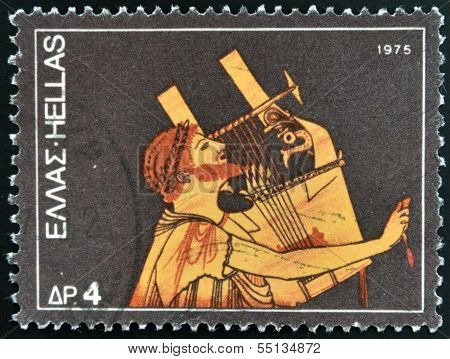 stamp dedicated to the traditional musical instruments shows an ancient guitar player