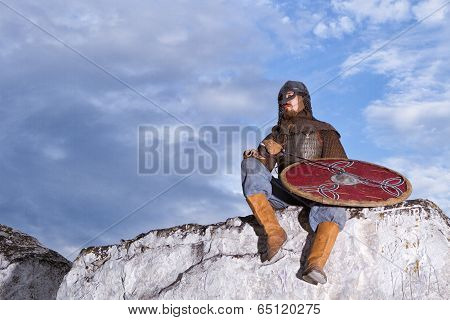Knight Sitting On A Rock