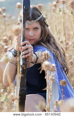 fairytale girl shooting bow and arrow