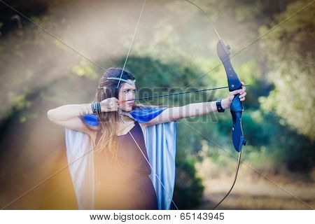 elven wood princess shooting bow and arrow