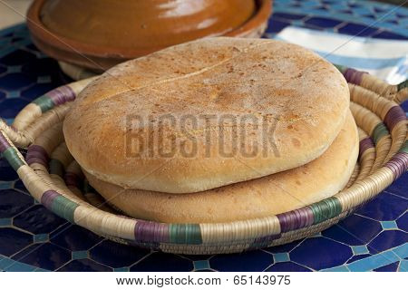 Moroccan bread and tagine on the table