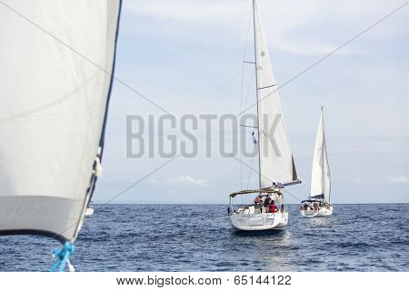 AEGEAN SEA, GREECE - APR 27, 2014: Unidentified sailboats participate in sailing regatta 