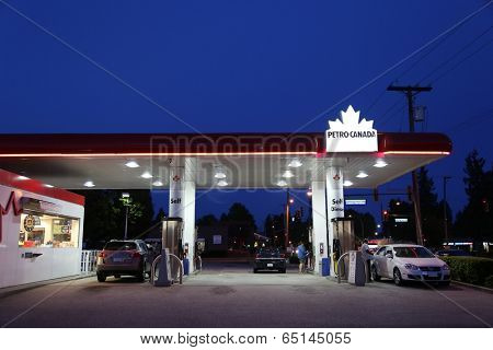 Port Coquitlam BC Canada - May 10, 2014 : One side of Petro Canada gas station on May 10, 2014. The company retained the Suncor Energy name for the merged corporation and its upstream operations.