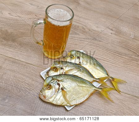 Smoked Vomer And Glass Of Lager Beer On A Wooden Table
