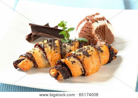 Chocolate chip croissants and scoop of vanilla chocolate ice cream