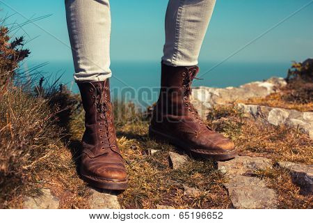 Young Woman Walking In The Mountains