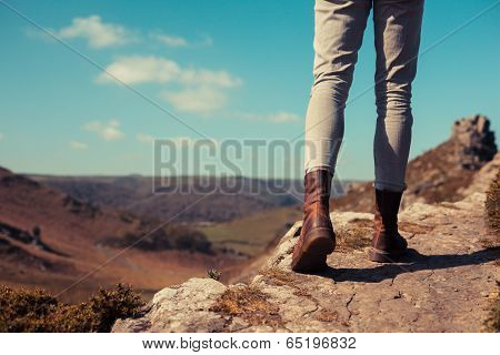 Young Woman Walking In The Mountains