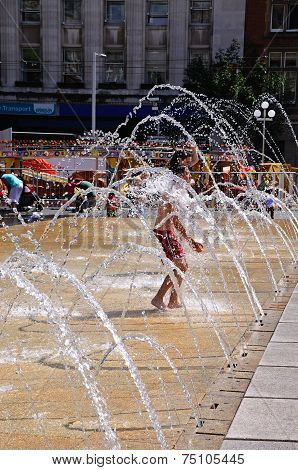 Teenager in fountain, Nottingham.