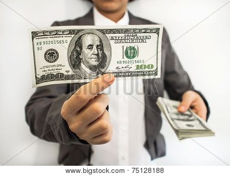 Business woman show the money ( U.S.Dollars)
