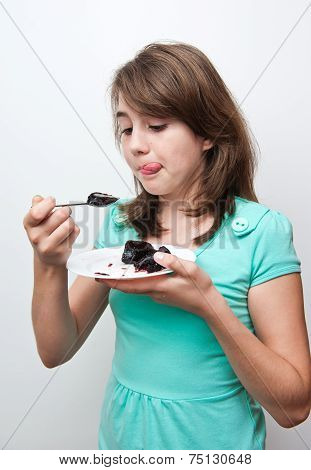 unny teen girl eating charlotte on the white background