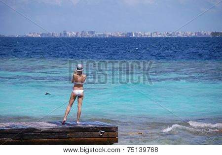 Woman At Timber Pier Making Photo