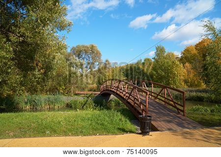 Wooden Bridge Across Small River
