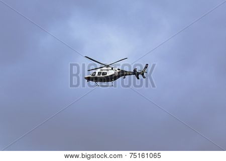 NYPD Bell 429 helicopter in the sky providing security during New York City Marathon start