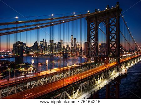 New York City - beautiful sunset over manhattan with manhattan and brooklyn bridge