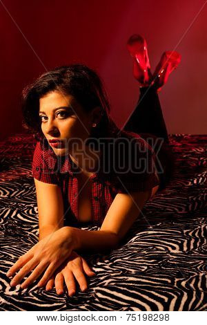 Woman Laying on Striped Bed