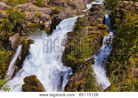 Waterfall near Briksdal glacier - Norway - nature and travel background