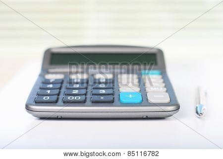 Calculator on a white table