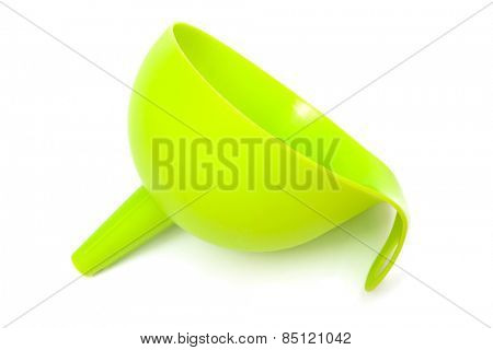 green plastic funnel with a white background