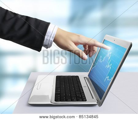 modern laptop and a hand