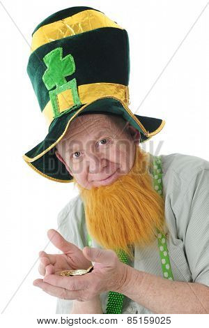 Closeup image of a bearded Irish man in a tall Irish hat happy with his hands full of Irish gold.  On a white background.