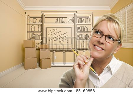 Daydreaming Woman Holding Pencil In Empty Rom with Built In Shelf Design Drawing on Wall.