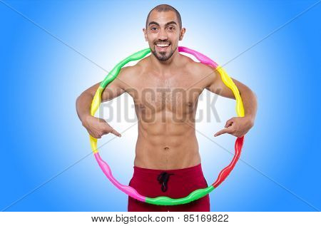 Man doing excecises with hula hoop