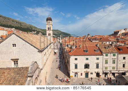 DUBROVNIK, CROATIA - MAY 26, 2014: View on Stradun and the Franciscan Monastery from old city walls. Stradun is 300 meters long main pedestrian street in Dubrovnik.