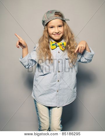 Dansing child. Motions fashion girl studio shot