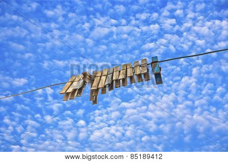 Old Clothespin Under Blue Sky I