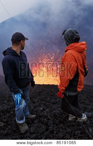 Eruption Tolbachik Volcano On Kamchatka, Tourists Watch The Fountain Lava Escaping From Volcano