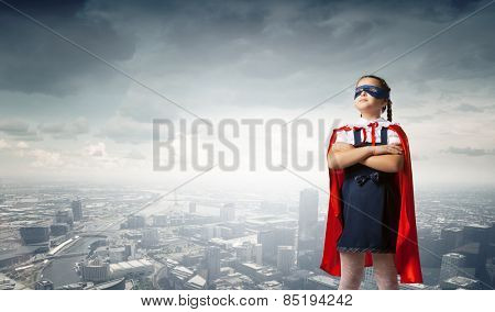 Girl of school age in super hero costume