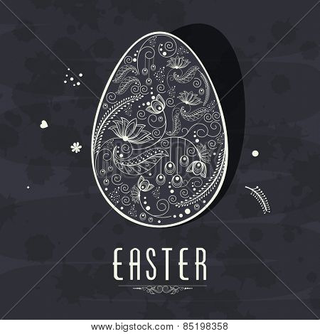 Beautiful floral design decorated Easter egg on grungy background.