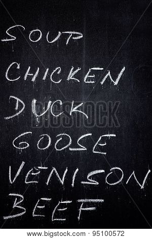 Restaurant Advertising Blackboard With Food And Drink List In Chalk