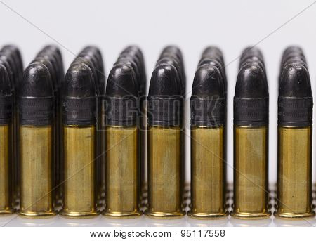 ammunition from the gun on 100 dollar bills