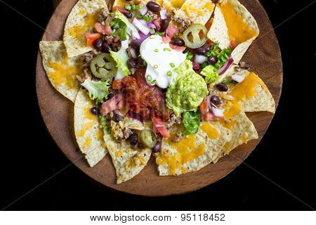 Homemade Nachos with tortilla chips cheese and guacamole,
