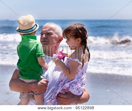 grandfather holding his grandkids