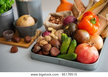 Closeup Of Autumn Fruits, Vegetables, Nuts On Kitchen Counter