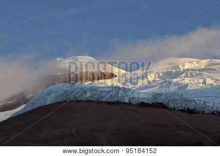 Summit, Glacier And Yanasacha Rock Wall In The Cotopaxi Volcano At Dusk