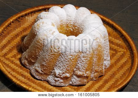Gugelhupf Gugelhopf Guglhupf cake on a rustic wooden board