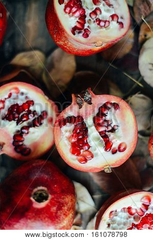 Ripe Pomegranate Fruit On Wooden Vintage Background. Red Juice P