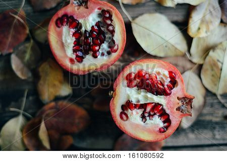 Ripe Pomegranate Fruit On Wooden Vintage Background. Red Juice P