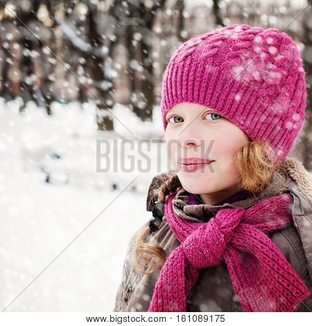 Cute Young Girl with Snow in Winter Park Outdoor