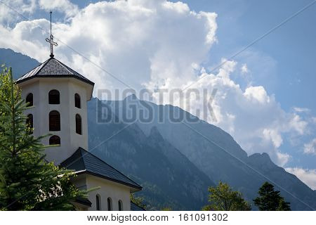 Church tower with mountains in background - Predeal