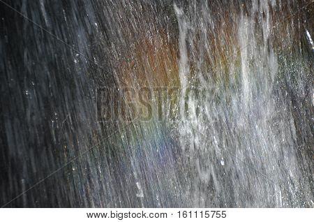 Rainbow at the waterfall Millomeris in the mountains in Cyprus